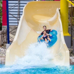 Father and Son On a Water Slide